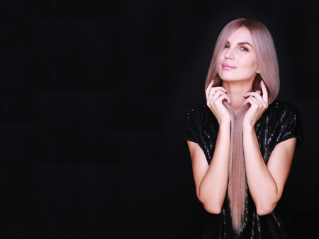 Portrait of beautiful woman with natural make up and long purple hair