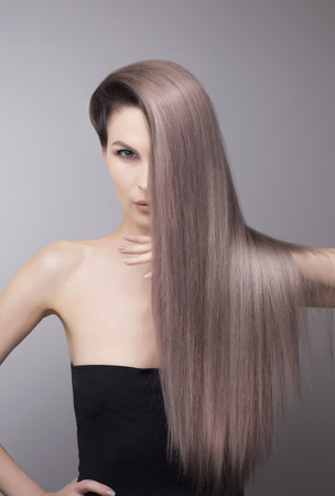 Pattern of a trendy purple blonde hair colour. Portrait studio shot.の写真素材