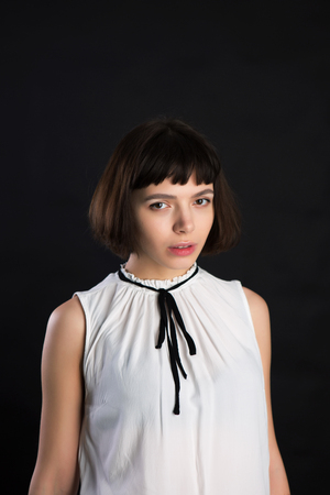 Amelie movie styled portrait. Short cutted brunette hair young girl with bare face.の写真素材