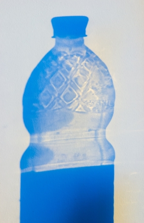 Projection of transparent shadows on a white wallの写真素材