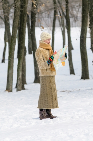 A woman lost in the forest in winterの写真素材