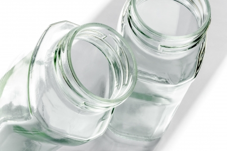 Transparent glass jars on white, with high-key effectの写真素材