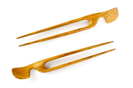 A pair of wooden hairsticks on white backgroundの写真素材