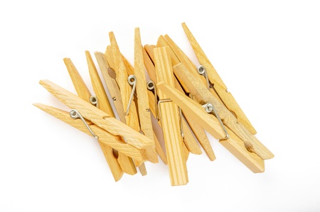 A little heap of wooden clothespin on white backgroundの写真素材
