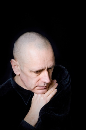 Portrait of a caucasian man on black backgroundの写真素材