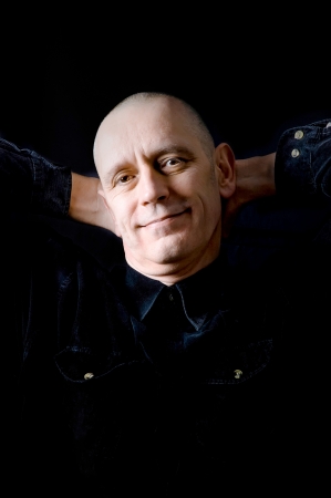 Portrait of a caucasian man on black backgroundの写真素材