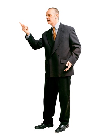 An handsome man in black suit, indicating something with the finger, on white backgroundの写真素材