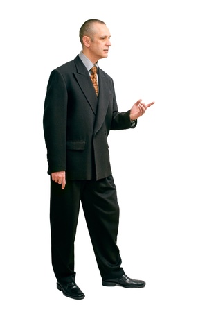 An handsome man in black suit, indicating something with the finger, on white backgroundの写真素材