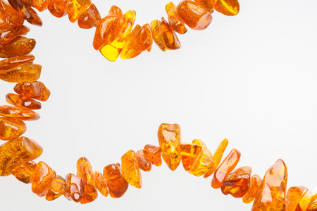Orange natural amber necklace with space for copy textの写真素材