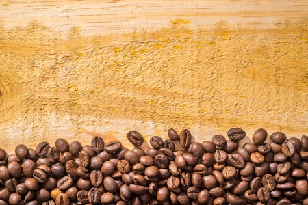 coffee beans and light wood textureの写真素材