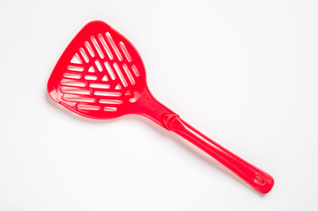 A plastic pooper scooper to clean cat's or dog's excrementsの写真素材