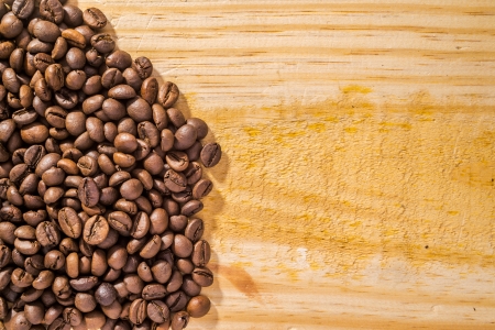coffee beans and light wood textureの写真素材