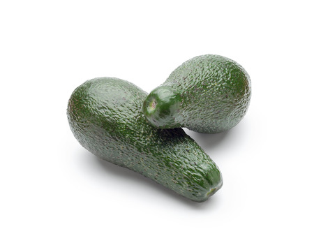 Two green avocados isolated on white backgroundの写真素材