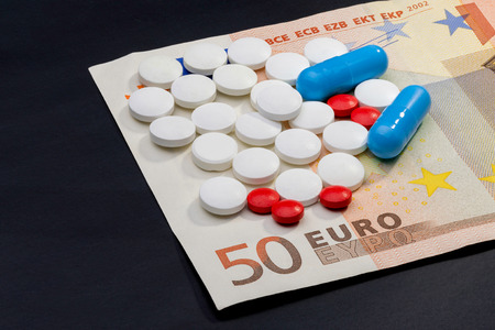 Pils and capsules with Euro money