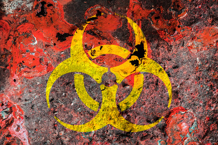 Biohazard symbol on a rust metal plateの写真素材