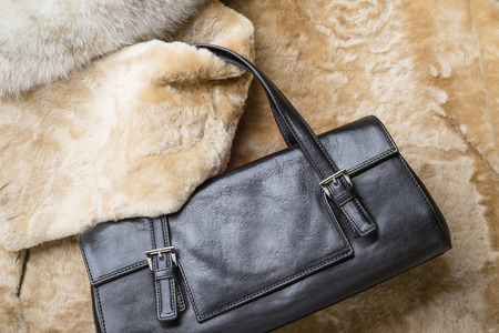 A black leather bag of warm blond sheepskin, blue fox and red sable mink fursの写真素材