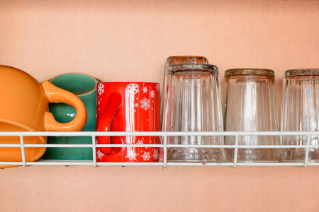 Drying cups and glasses in the dish rackの写真素材