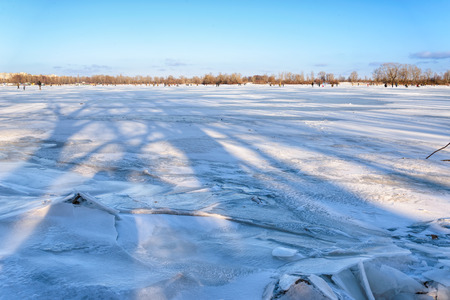 Kiev/Ukraine - January 07, 2015 - Kiev/Ukraine - January 07, 2015 -The Dnieper river is frozen. The ice is broken close to the river bankの写真素材