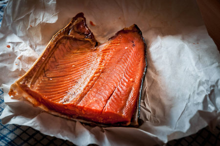 Smoked salmon from the Russian Kamchatka on white paperの写真素材