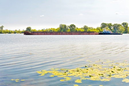 Barge on the Dnieper river during a sunny summer dayの写真素材
