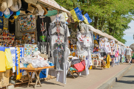 Kiev/Ukraine - July 31, 2015 - Souvenir shops in Andriyivskyy Descent. Traditional Matryoshka dolls and Ukrainian shirts are exposedのeditorial素材