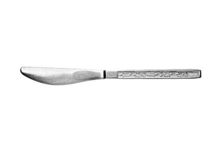 A soviet style metallic stainless inox table knife with decorations isolated on white background