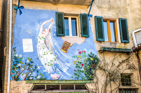 Saludecio/Italy - March 15, 2005: A mural painting in Saludecio illustrating the publication of the book Les Fleurs du mal (The Flowers of Evil) by the French author Charles Baudelaire in 1857のeditorial素材