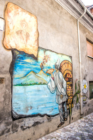 Saludecio/Italy - March 15, 2005: A mural painting in Saludecio illustrating an invention from the XIX century:のeditorial素材
