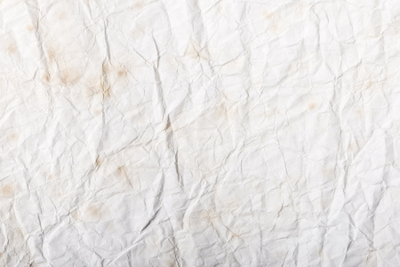 A crumpled white paper texture for background useの写真素材