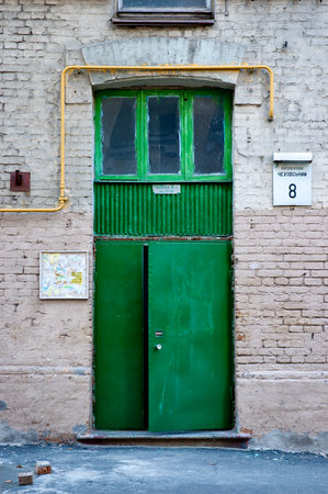 Kiev/Ukraine - July 28, 2006 - Entrance door of a soviet style building in Kiev, Ukraineのeditorial素材