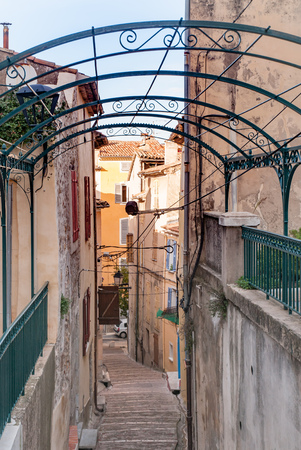 Walking down in a little narrow stairs street in the town of Brignoles in Provence, south of Franceの写真素材