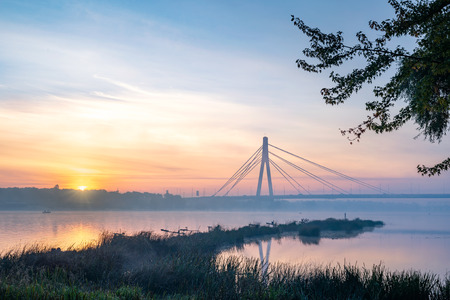 View of the Pivnichnyi Bridge (ex Moskovsky bridge) on the Dnieper river in Kiev, Ukraine, the morning at dawn, some minutes before trhe sune rises.の写真素材