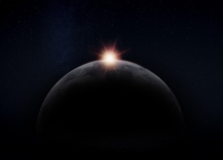 View of the dark hidden side of the Moon with the Sun behind it. Negative space for copy text.の写真素材