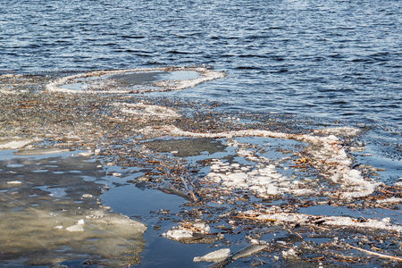 Circles of ice on the blue Dnieper river in Kiev, Ukraine, during winterの写真素材