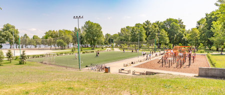 Kiev/Ukraine - May 31, 2019 - Sports equipment and football (soccer) field in Natalka Park in Kiev, Ukraine. People of all ages come to exercise near the Dnieper Riverのeditorial素材
