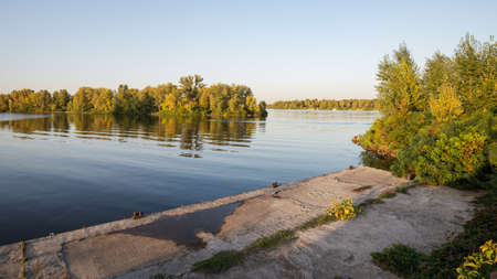 Landing stage on the Dnieper river in the Obolon district of Kiev, Ukraine, during a sunny summer eveningの写真素材