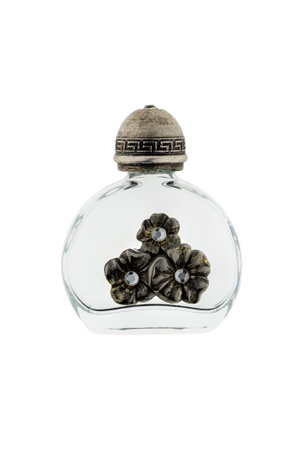 Antique little glass vial with silver ornaments, isolated on white background. It can be used for perfume or even poisonの写真素材