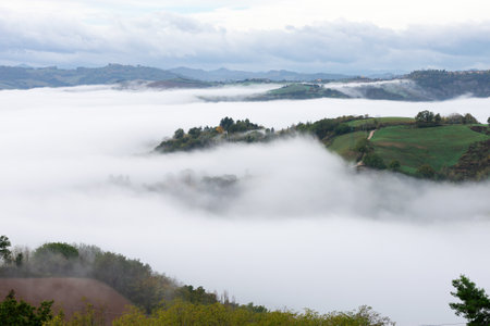 Morning mist and clouds over the Montefeltro hills near Belvedere Fogliense between Pesaro and...