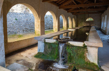 View of the washhouse in the small town of Mazaugues in the Var department, located at the eastern end of the Sainte-Baume massif, in the Provence region of Franceの写真素材