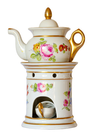 Antique Paris Porcelain. Veilleuse, a three-part tea pot set consisting of a base, a warming stand, fitted teapot and cover. Also called aÂ "Tisaniere" it wasÂ used to keep a "tisane" or herbal tea warm and also doubled as a small night-light.の写真素材