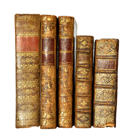 Row of antique books with a leather cover and golden ornaments on isolated on white backgroundの写真素材