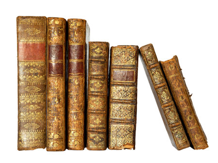 Row of antique books with a leather cover and golden ornaments on isolated on white backgroundの写真素材