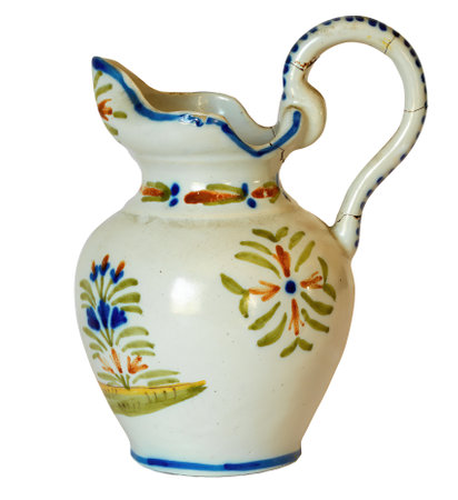 French, White-Glazed Ceramic Jug or Water Cruche, with Lid and floral decoration, isolated on white backgroundの写真素材