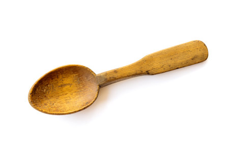 A little wooden spoon isolated on white backgroundの写真素材