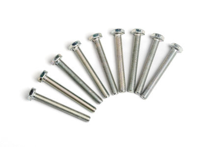 Nine stainless steel bolts isalated on white backgroundの写真素材