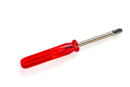 Socket wrench screw driver with red handle, metal hex nut key, hand tool screwdriver, isolated on white backgroundの写真素材