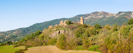 Torrione di Pietrafagnana, The Giant's Finger or Devil's Finger, in the Carpegna mountains in the Italian Montefeltro, seen at morning before the sunrise.の写真素材