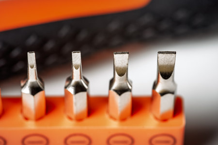 Detail of flathead magnetic precision screwdriver bits on white backgroundの写真素材