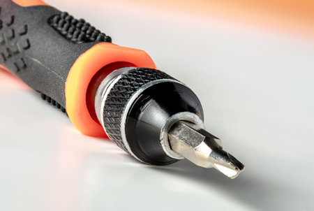 Detail of tri-point screwdriver on white background