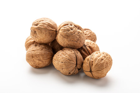 Heap of walnuts fruits on white backgroundの写真素材